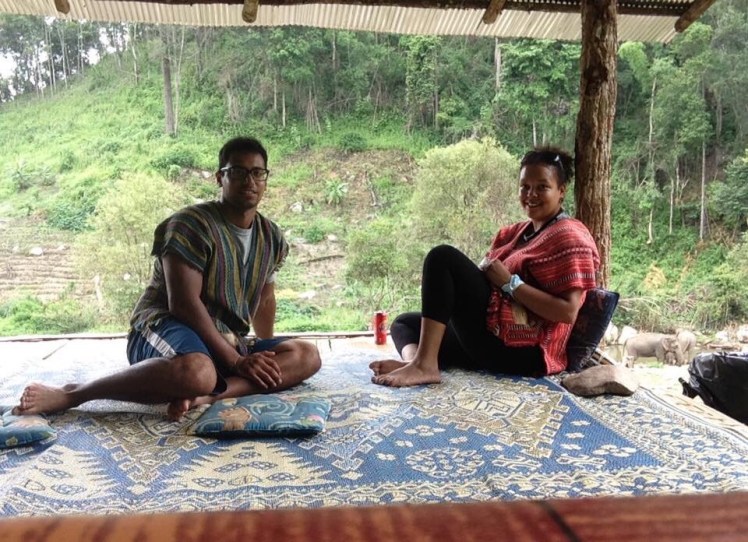 Sitting above the elephants on the right hand side in our mahut clothing