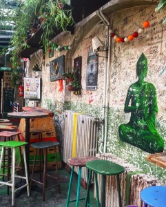 Szimpla Ruin bar during he day. Art work and graffiti on the walls