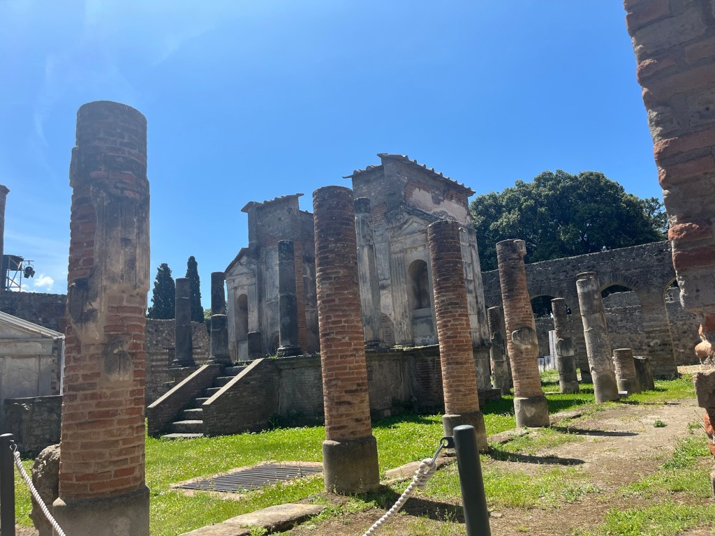 Ruins and Pompeii showing columns and a building. 